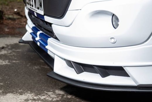 this image shows a ford transit custom bodykit on a white van with black inserts.