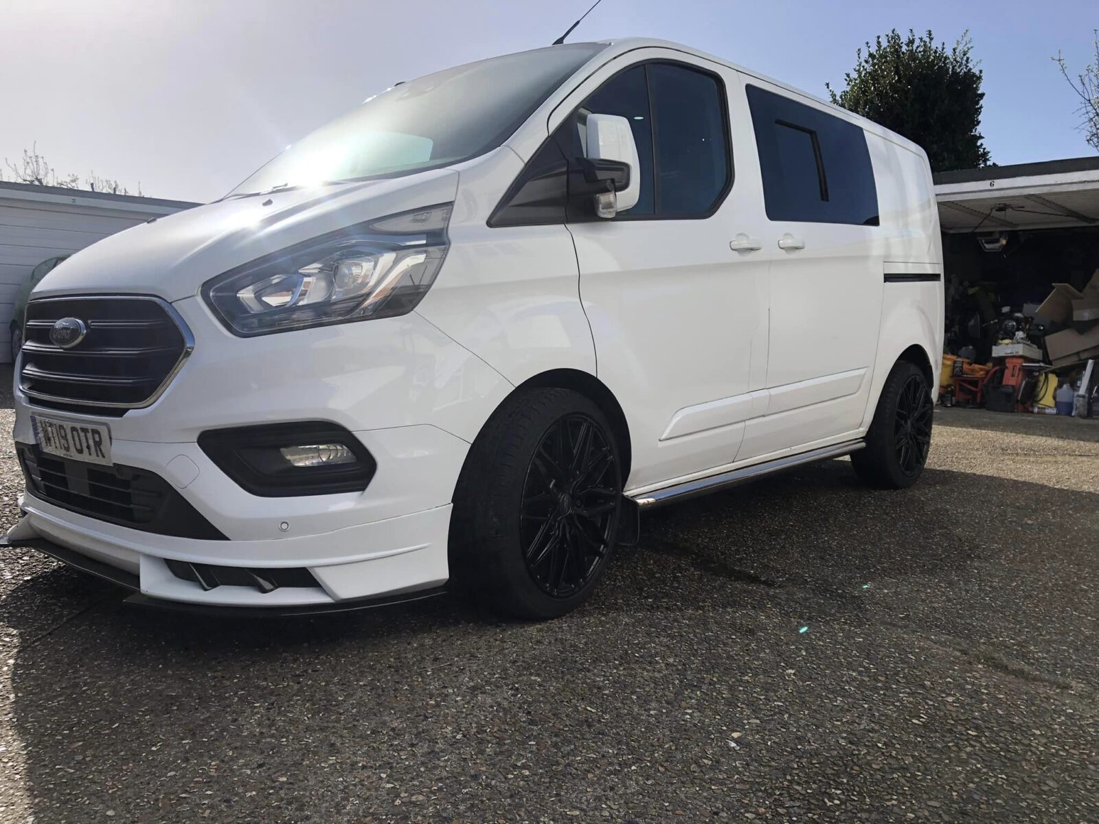 A white Ford Transit Custom with the V1 Front add on installed