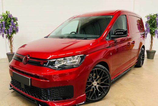 A red Volkswagen Caddy Mk5 with our bodykit fitted.